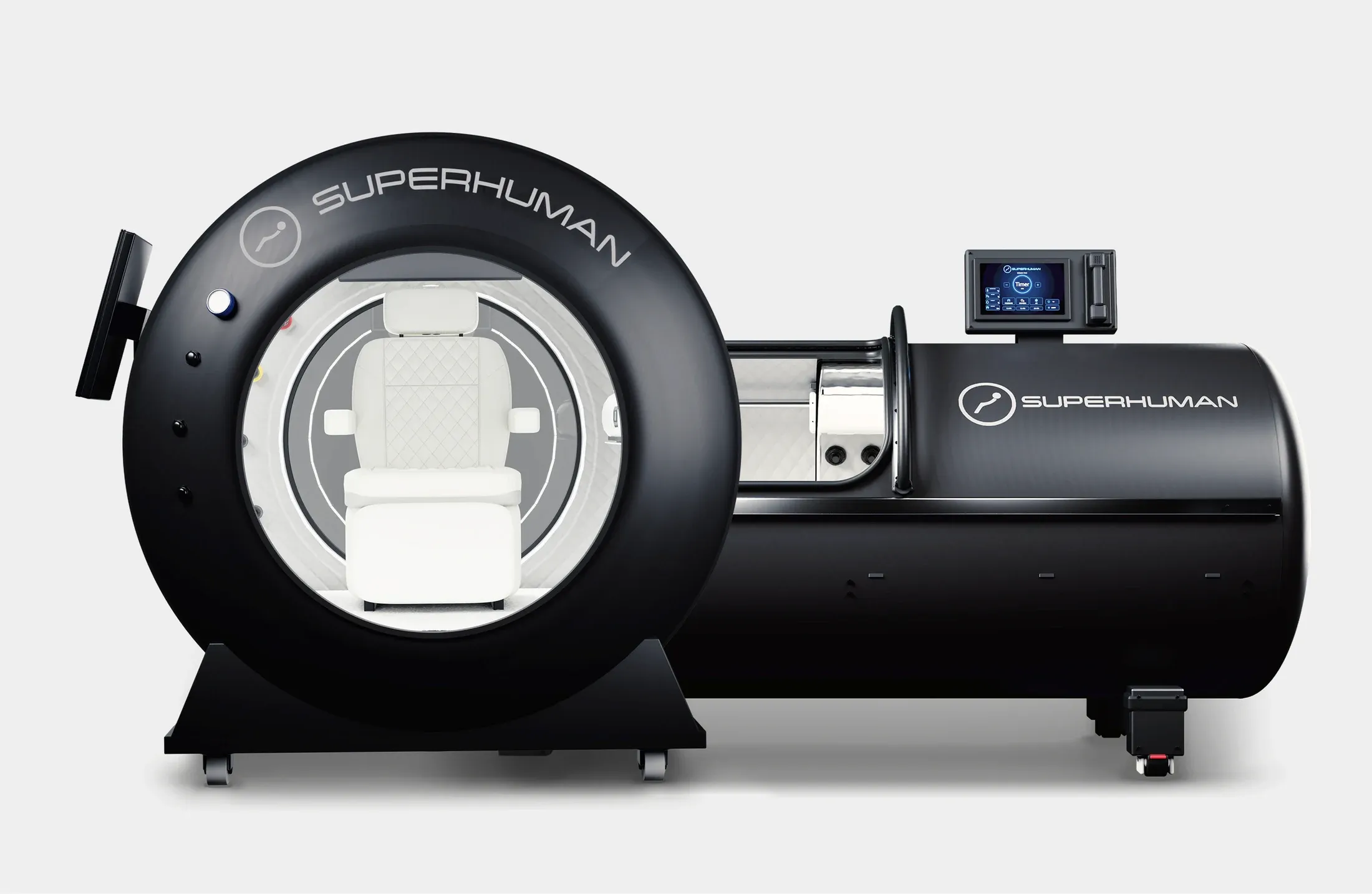Superhuman X seated hard-shell hyperbaric chamber beside the L1 lying hard-shell chamber