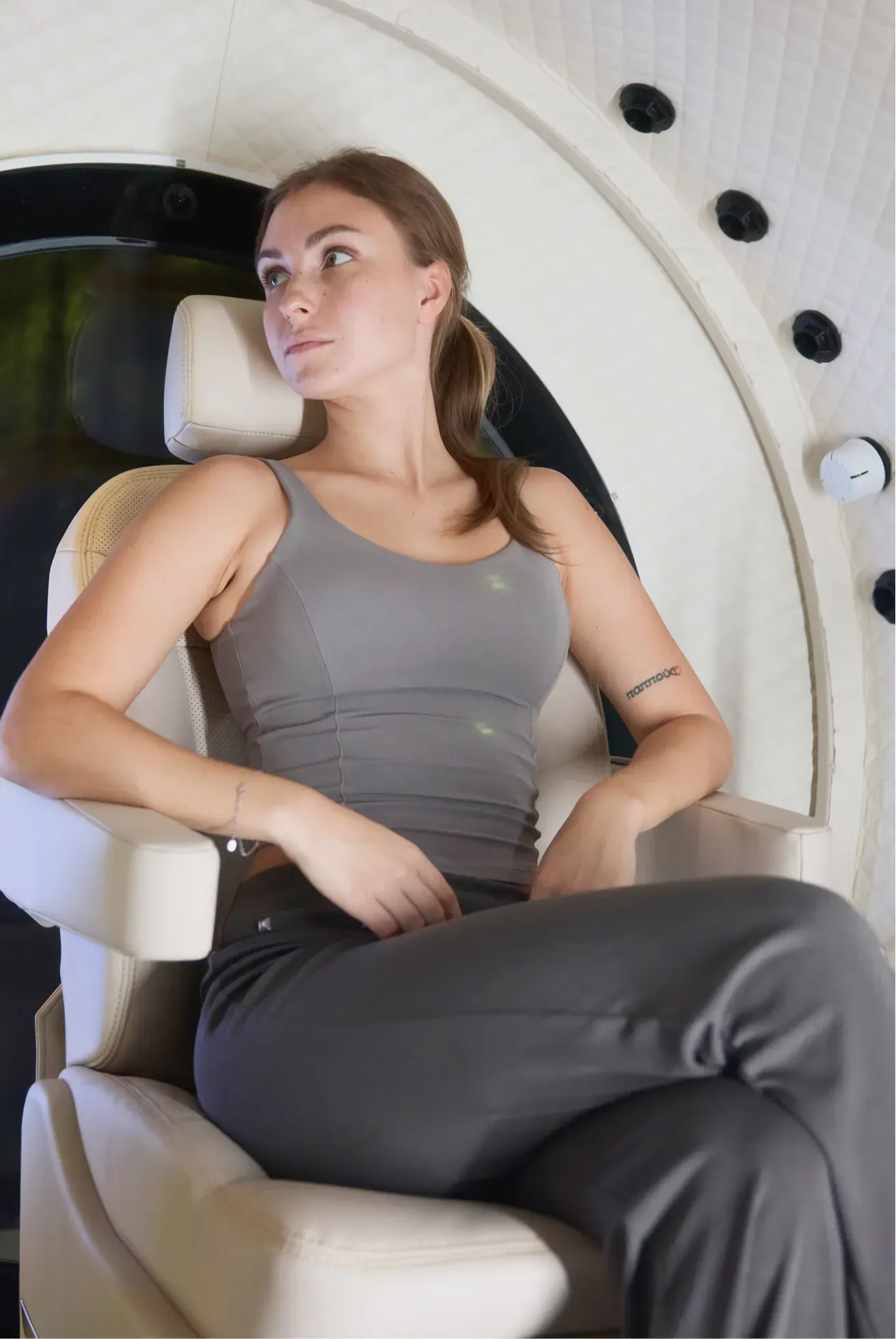 A woman seated inside the Superhuman X chamber