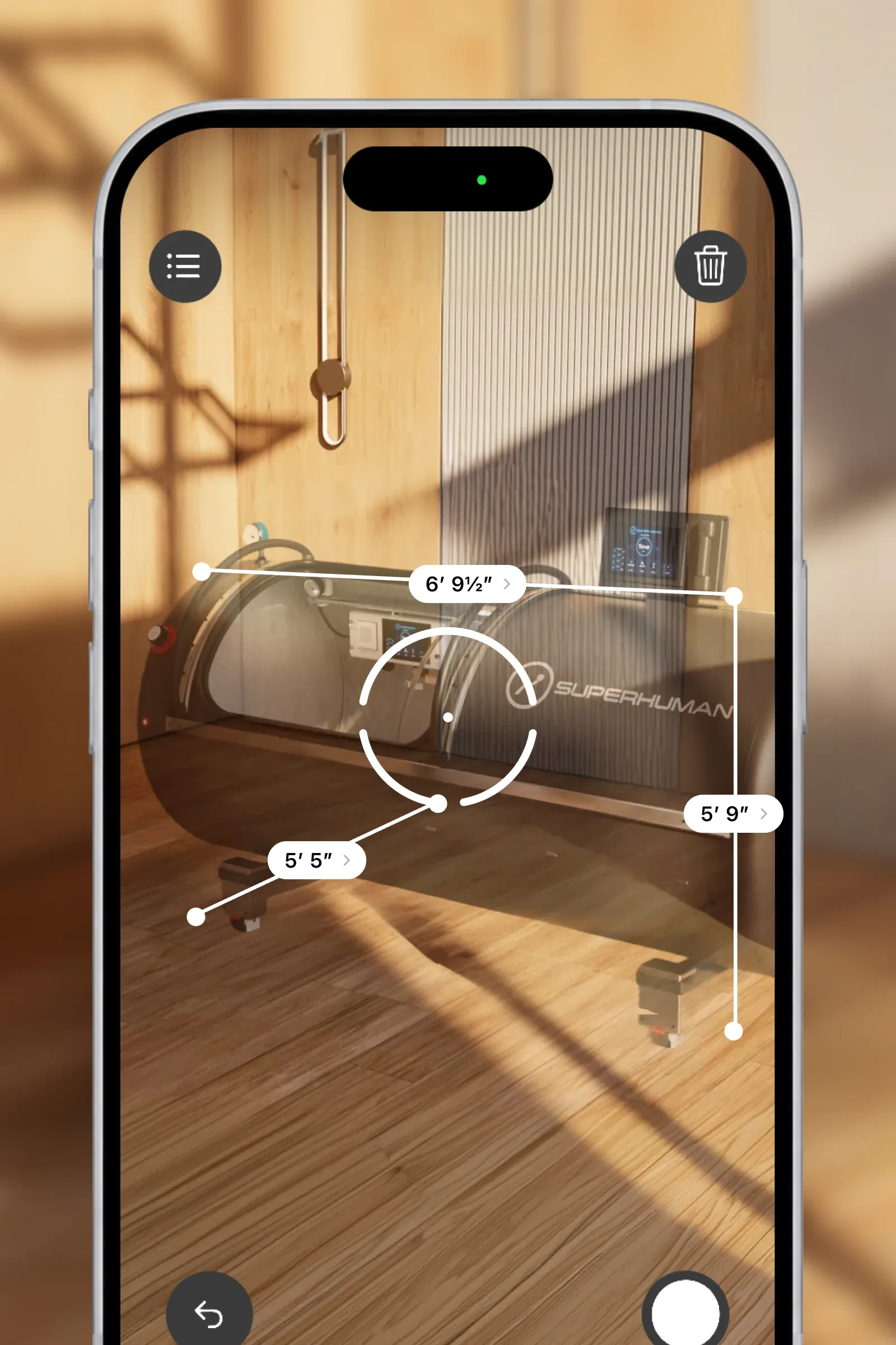A phone measuring the L1 in a room in augmented reality, its length, width and height marked