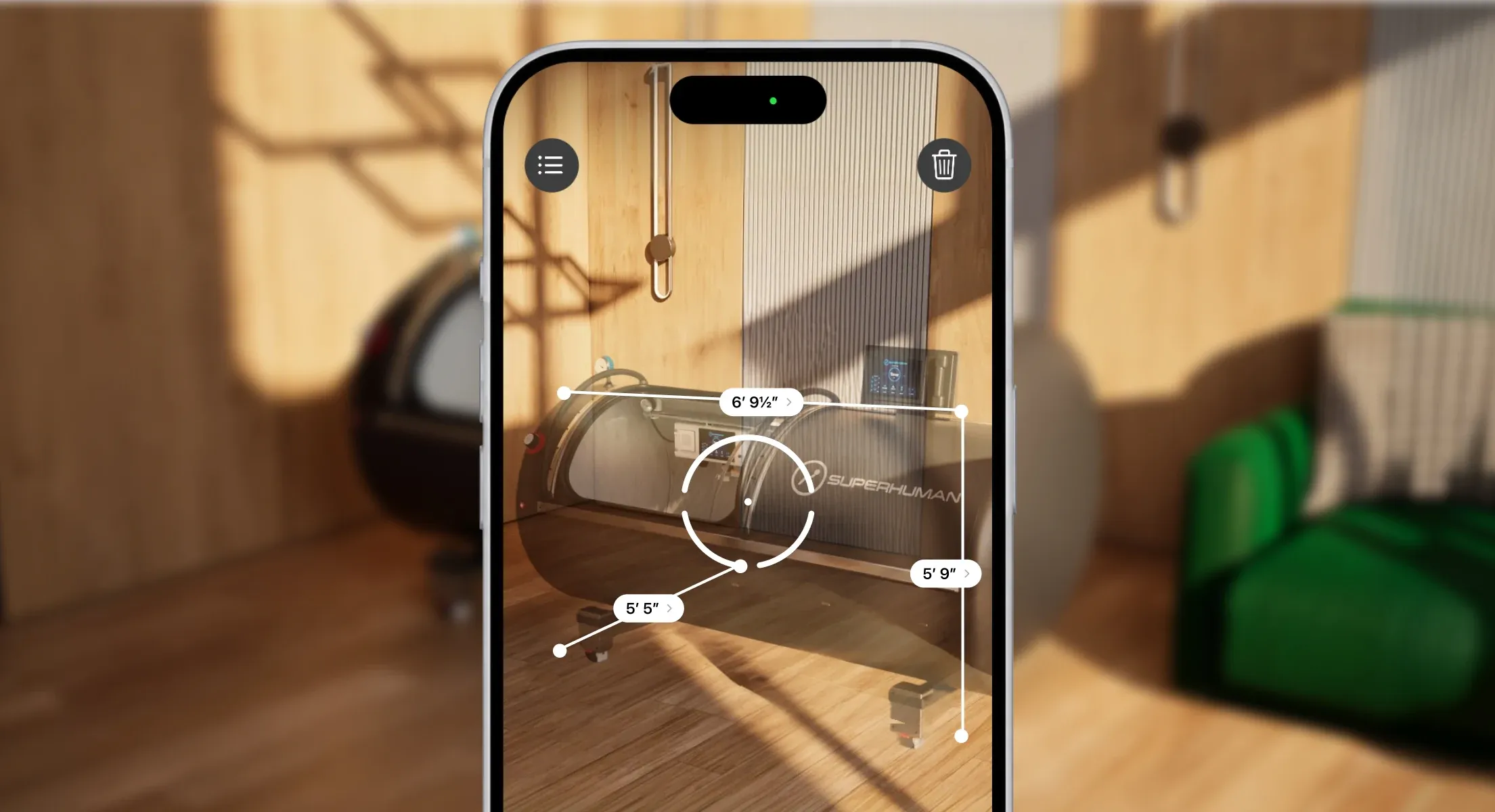 A phone measuring the L1 in a room in augmented reality, its length, width and height marked