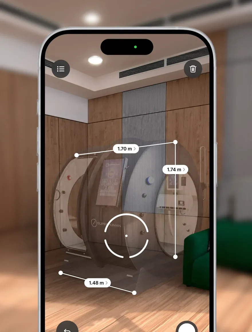 A phone placing the X in a room in augmented reality, its width and depth measured
