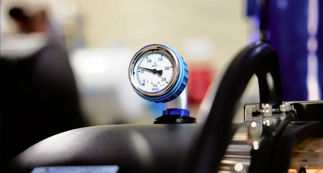 The pressure gauge on a Superhuman chamber, with the chamber blurred behind it